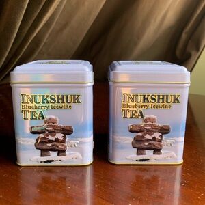 Lot of Two Metal Inukshuk Tea Tins